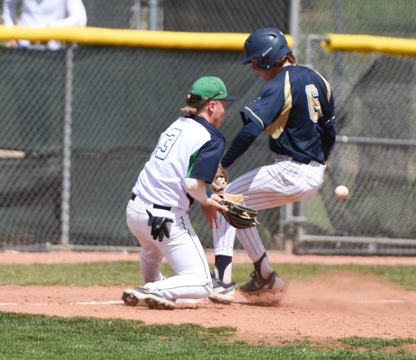 Legacy base runner Kieran Gaffney gets to third safely as ThunderRidge third baseman Brock Lansville covers during the first Region 8 game of CHSAA's 5A baseball tournament at Legacy May 23. The Lighting shut out the Grizzlies 8-0.